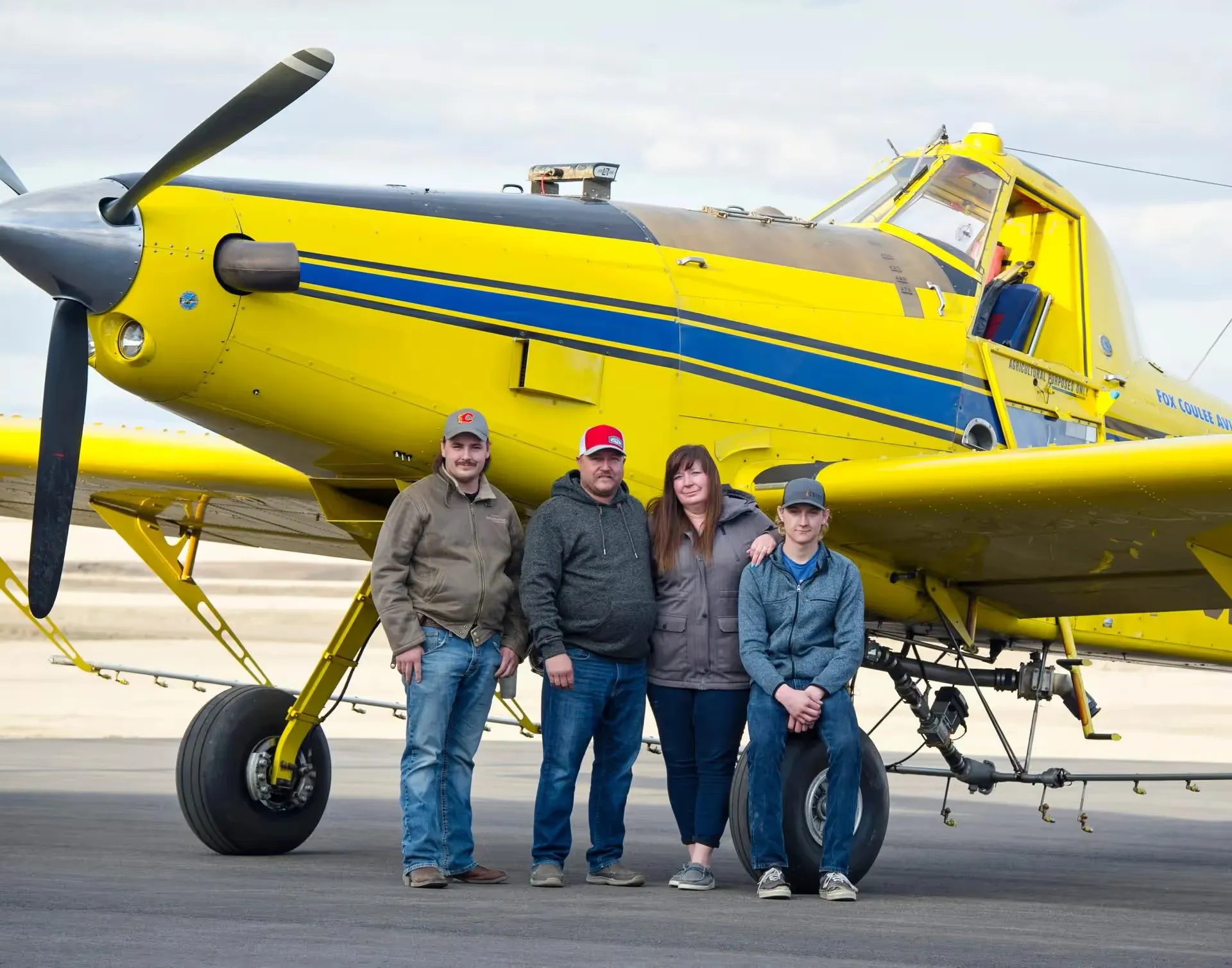 A image of people in front of a plane